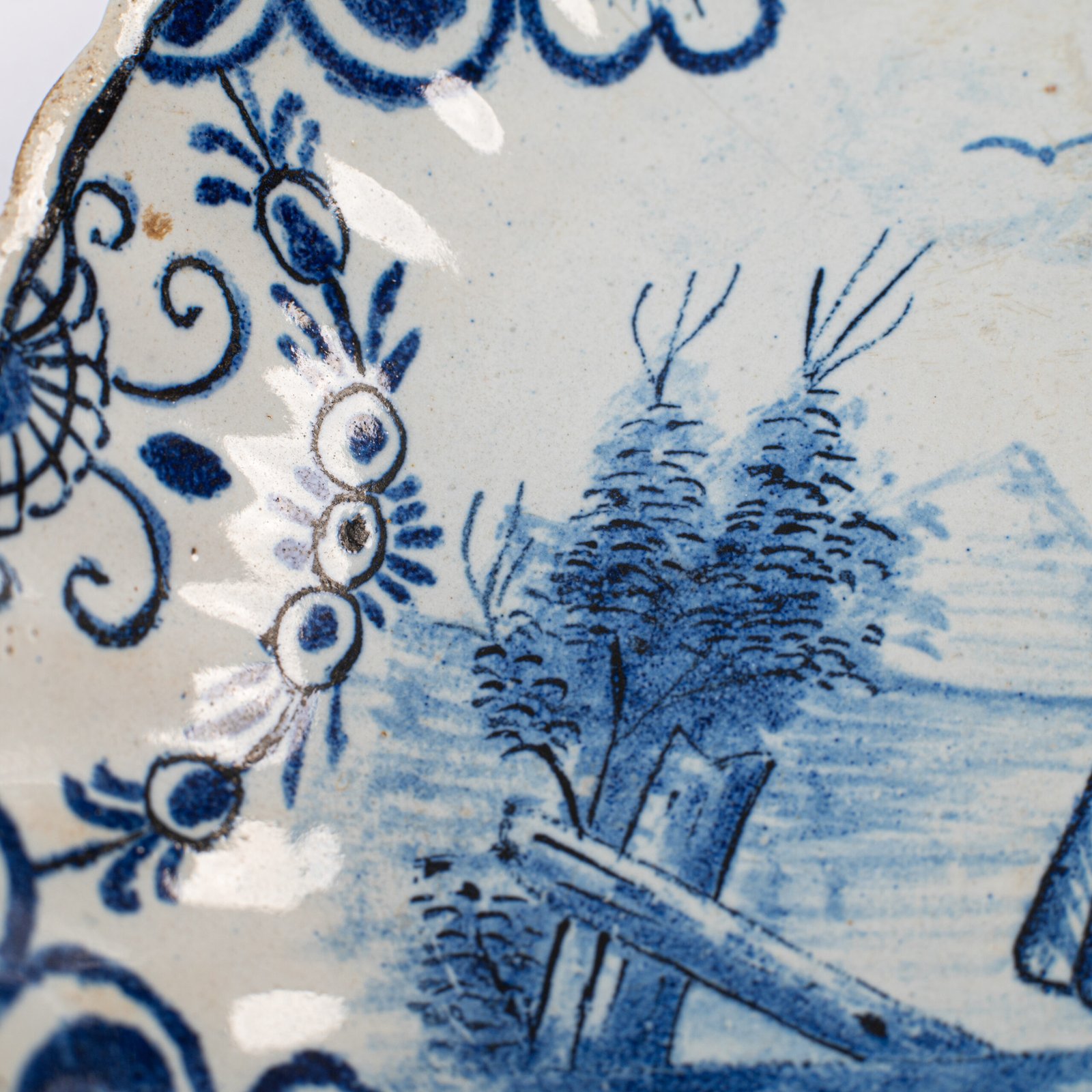 Rare 17th-century Delft blue plate by Adriaen Kocks, ca. 1686–1700, cabinet plate with finely painted rural female figure, signed AK.