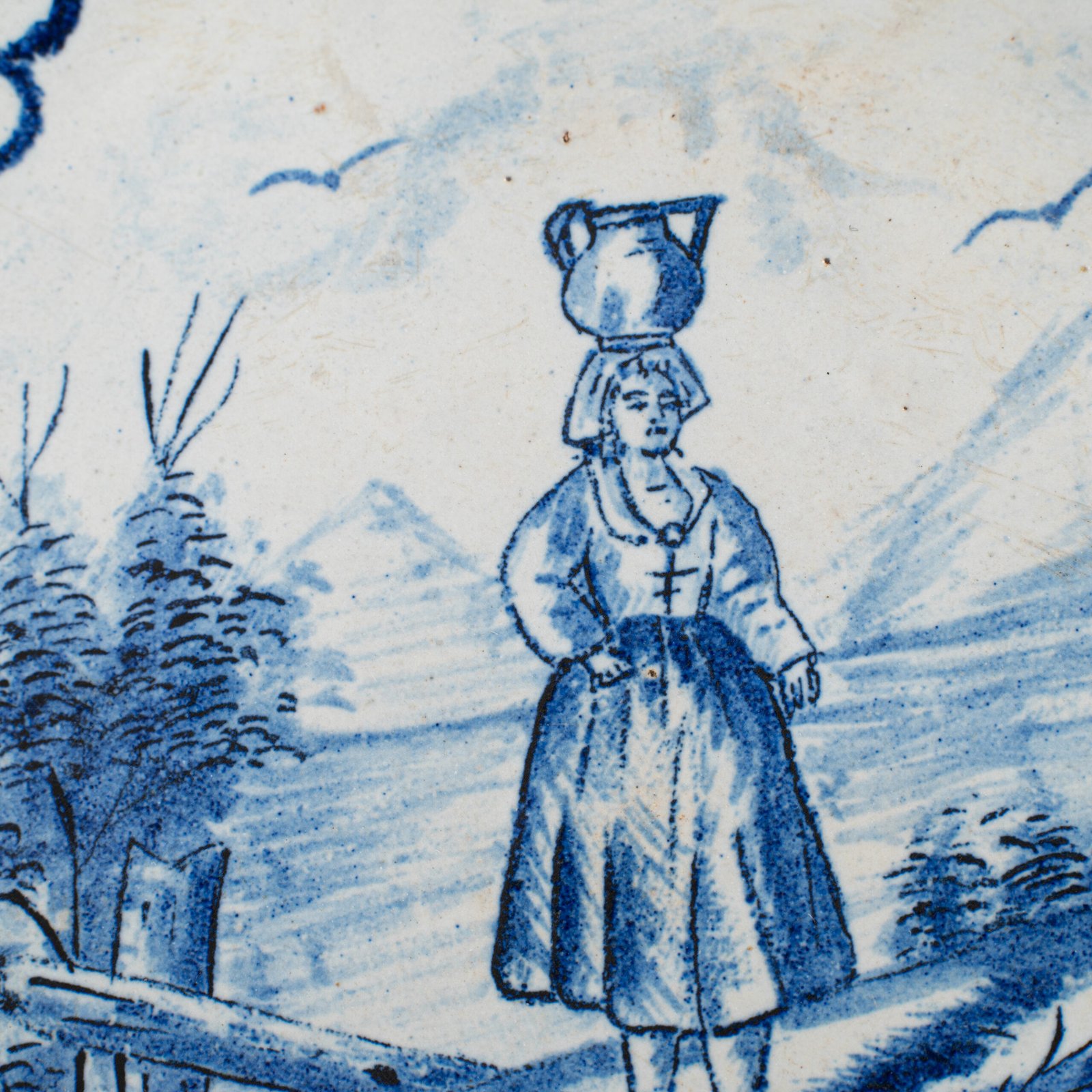 Rare 17th-century Delft blue plate by Adriaen Kocks, ca. 1686–1700, cabinet plate with finely painted rural female figure, signed AK.