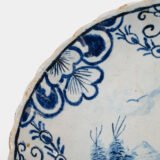 Rare 17th-century Delft blue plate by Adriaen Kocks, ca. 1686–1700, cabinet plate with finely painted rural female figure, signed AK.