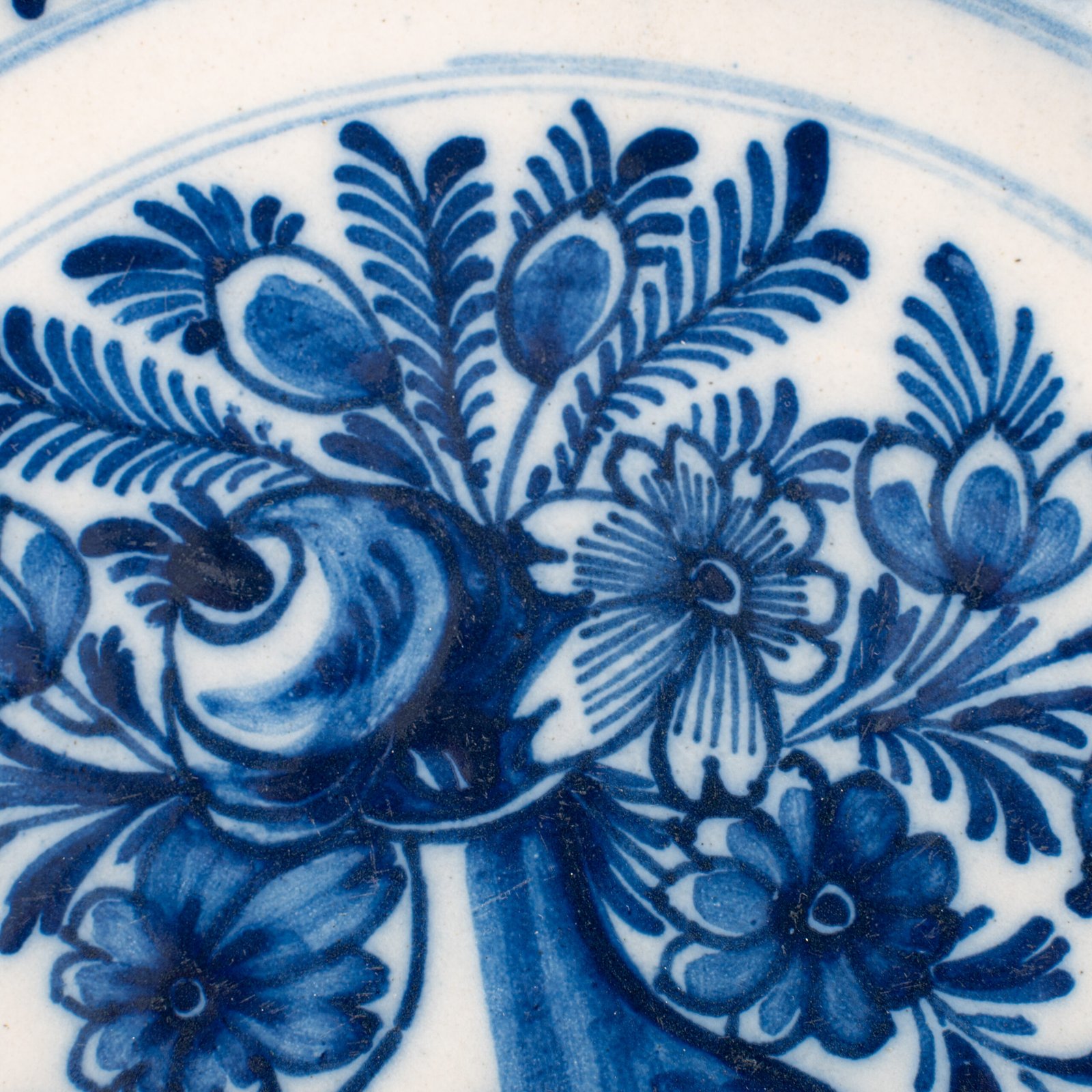 Delft blue plates – antique hand-painted Delftware pair, 18th century
