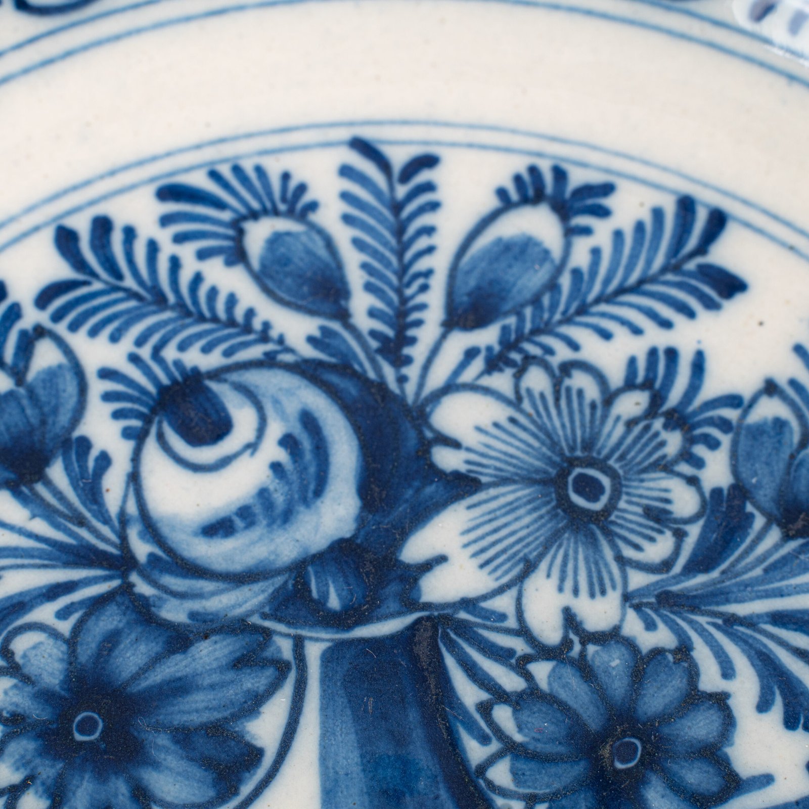 Delft blue plates – antique hand-painted Delftware pair, 18th century