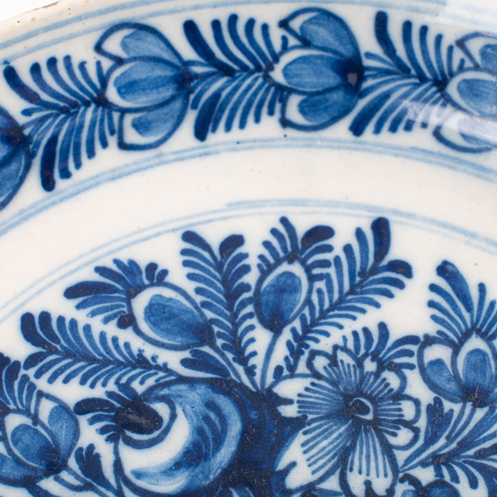 Delft blue plates – antique hand-painted Delftware pair, 18th century