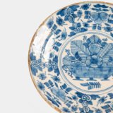 Exceptional 18th century Delft blue and white bowl-shaped plate with floral basket decoration, ca. 1700–1740, Dutch tin-glazed earthenware