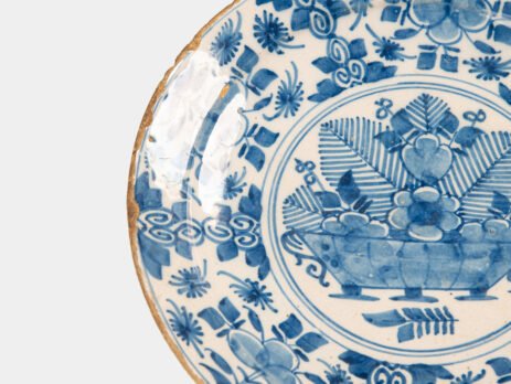 Exceptional 18th century Delft blue and white bowl-shaped plate with floral basket decoration, ca. 1700–1740, Dutch tin-glazed earthenware