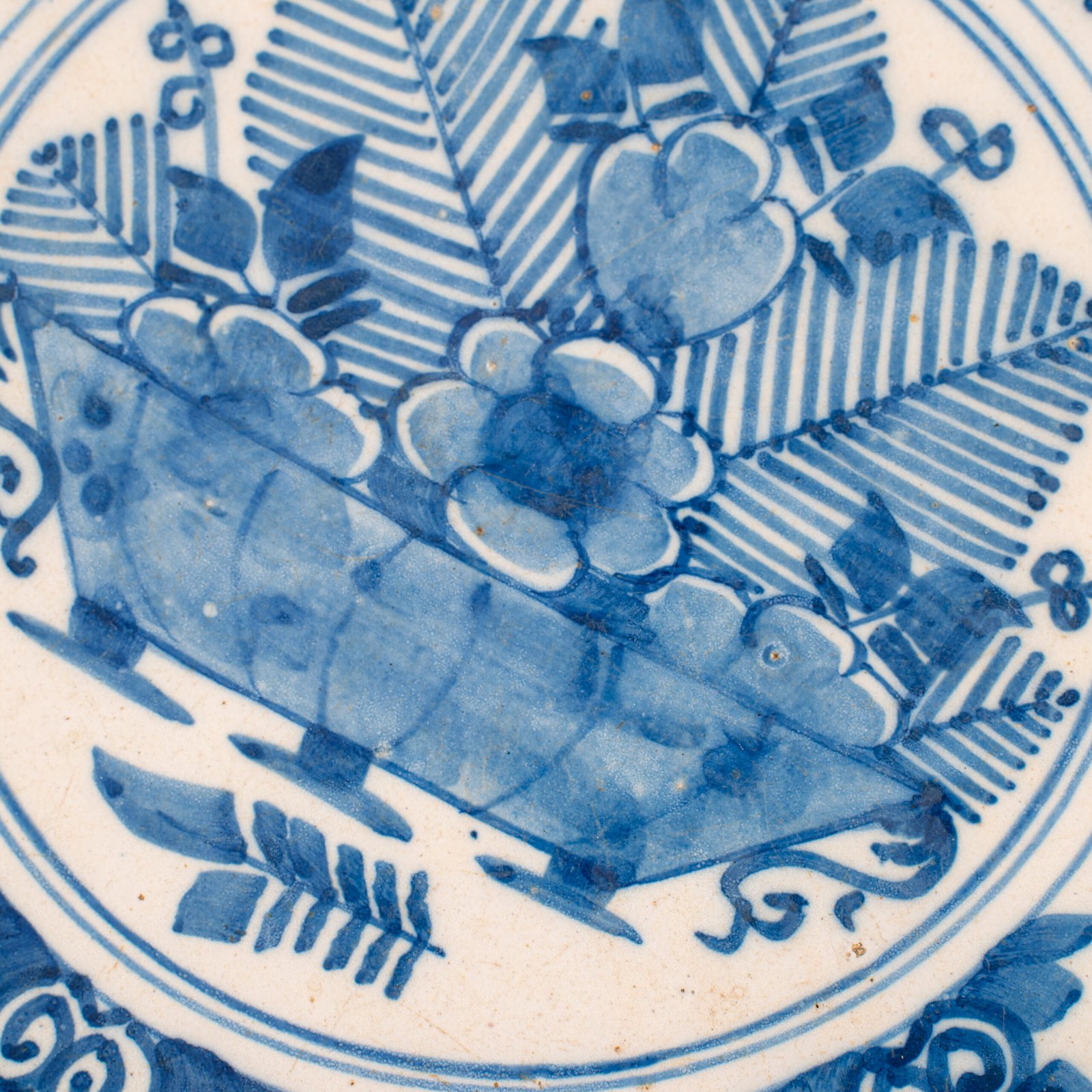 Exceptional 18th century Delft blue and white bowl-shaped plate with floral basket decoration, ca. 1700–1740, Dutch tin-glazed earthenware