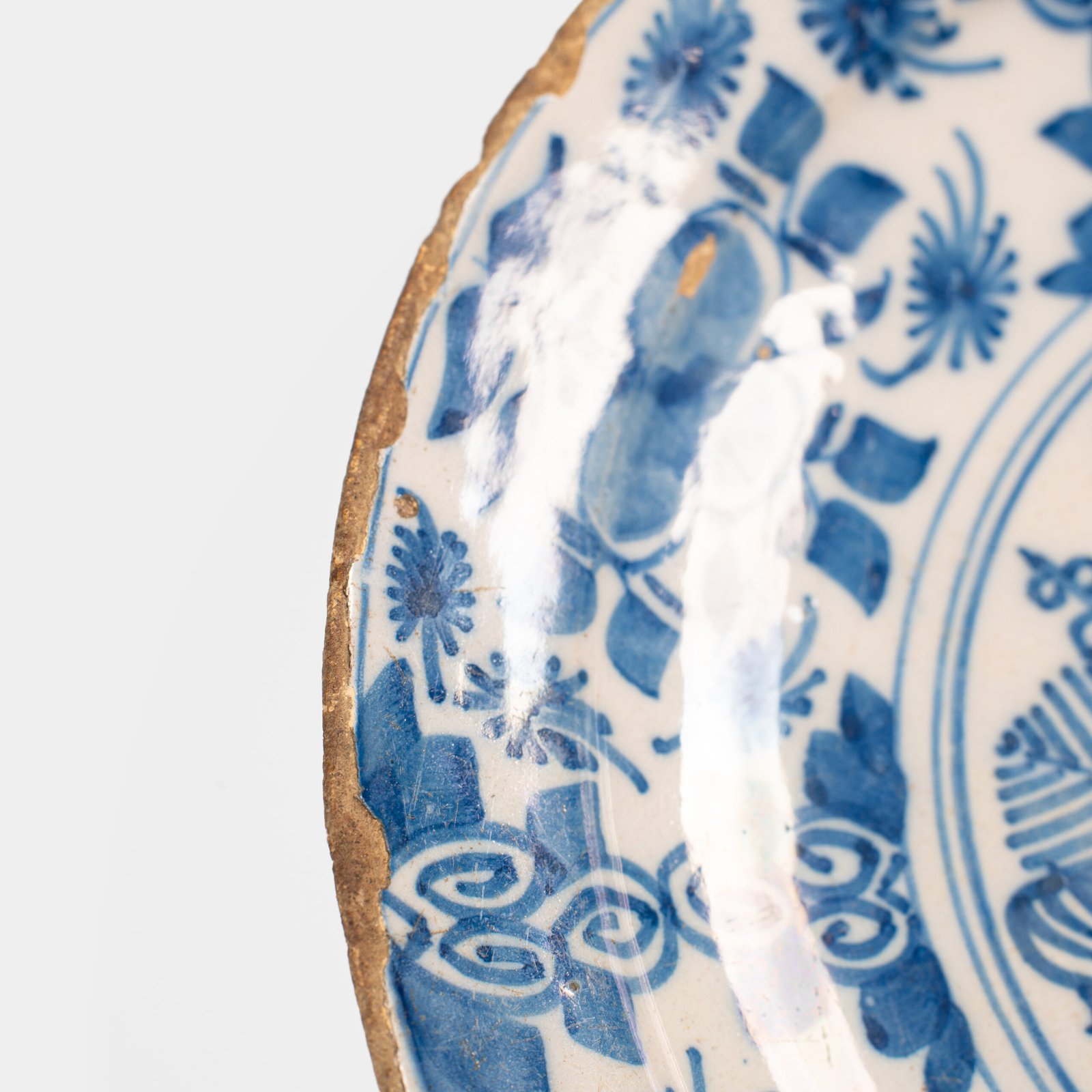 Exceptional 18th century Delft blue and white bowl-shaped plate with floral basket decoration, ca. 1700–1740, Dutch tin-glazed earthenware