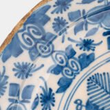 Exceptional 18th century Delft blue and white bowl-shaped plate with floral basket decoration, ca. 1700–1740, Dutch tin-glazed earthenware