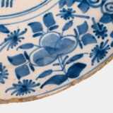 Exceptional 18th century Delft blue and white bowl-shaped plate with floral basket decoration, ca. 1700–1740, Dutch tin-glazed earthenware