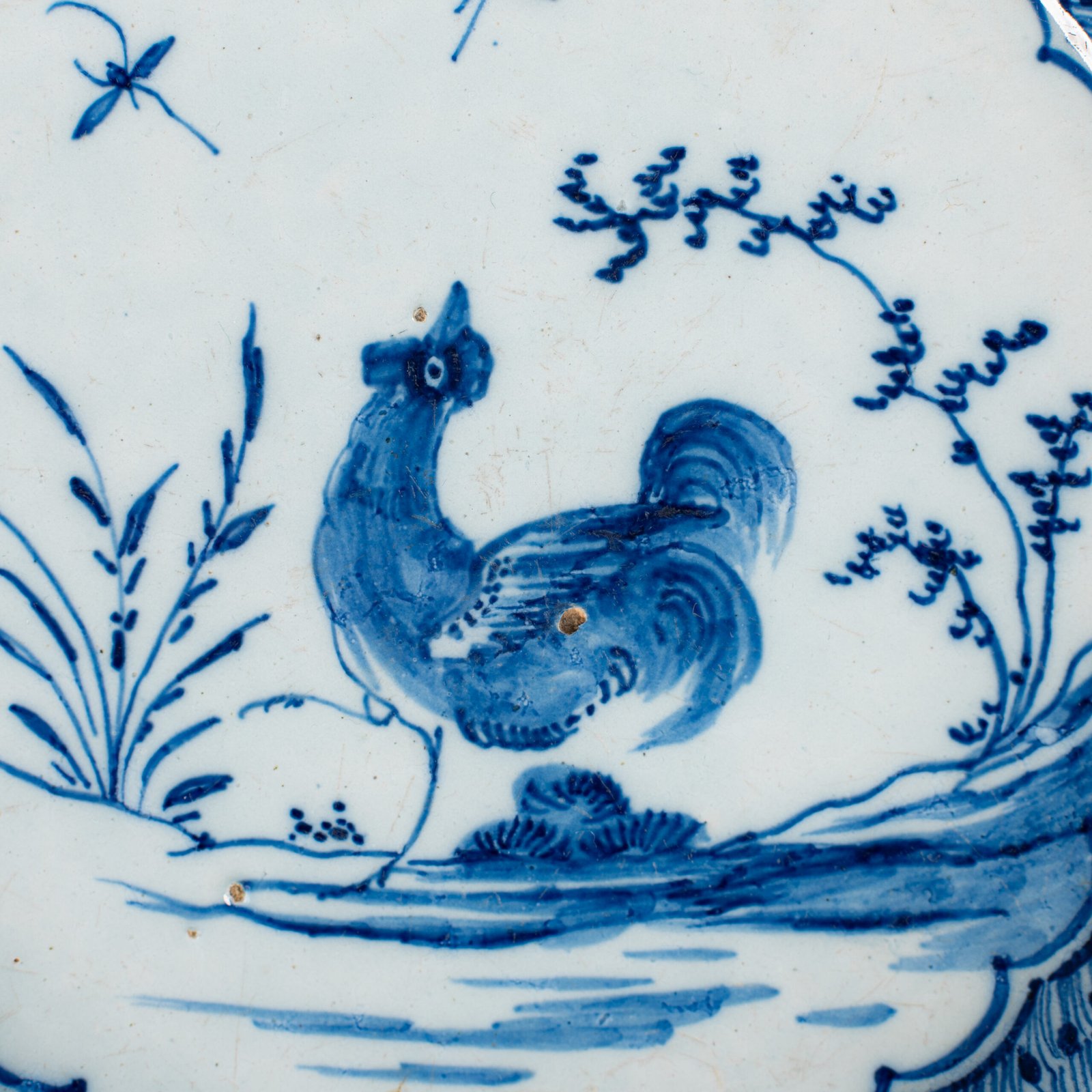 Exceptional Delft plate 18th century by Van den Briel with cobalt-blue rooster and floral decoration, De Grieksche A workshop.