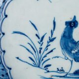 Exceptional Delft plate 18th century by Van den Briel with cobalt-blue rooster and floral decoration, De Grieksche A workshop.