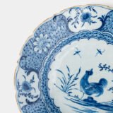 Exceptional Delft plate 18th century by Van den Briel with cobalt-blue rooster and floral decoration, De Grieksche A workshop.