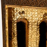 Dutch Mirror Cabinet in embossed brass with windmill motif, beveled mirror door and interior brushes, circa 1890–1920.