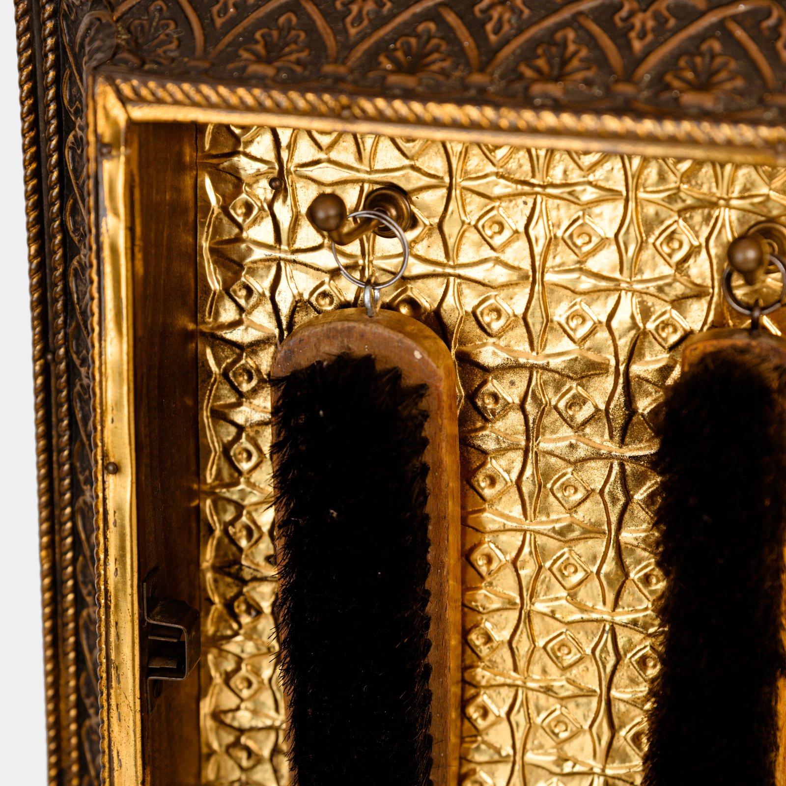 Dutch Mirror Cabinet in embossed brass with windmill motif, beveled mirror door and interior brushes, circa 1890–1920.
