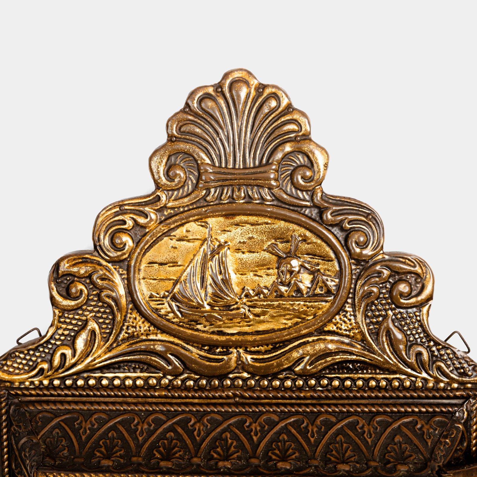 Dutch Mirror Cabinet in embossed brass with windmill motif, beveled mirror door and interior brushes, circa 1890–1920.