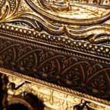 Dutch Mirror Cabinet in embossed brass with windmill motif, beveled mirror door and interior brushes, circa 1890–1920.