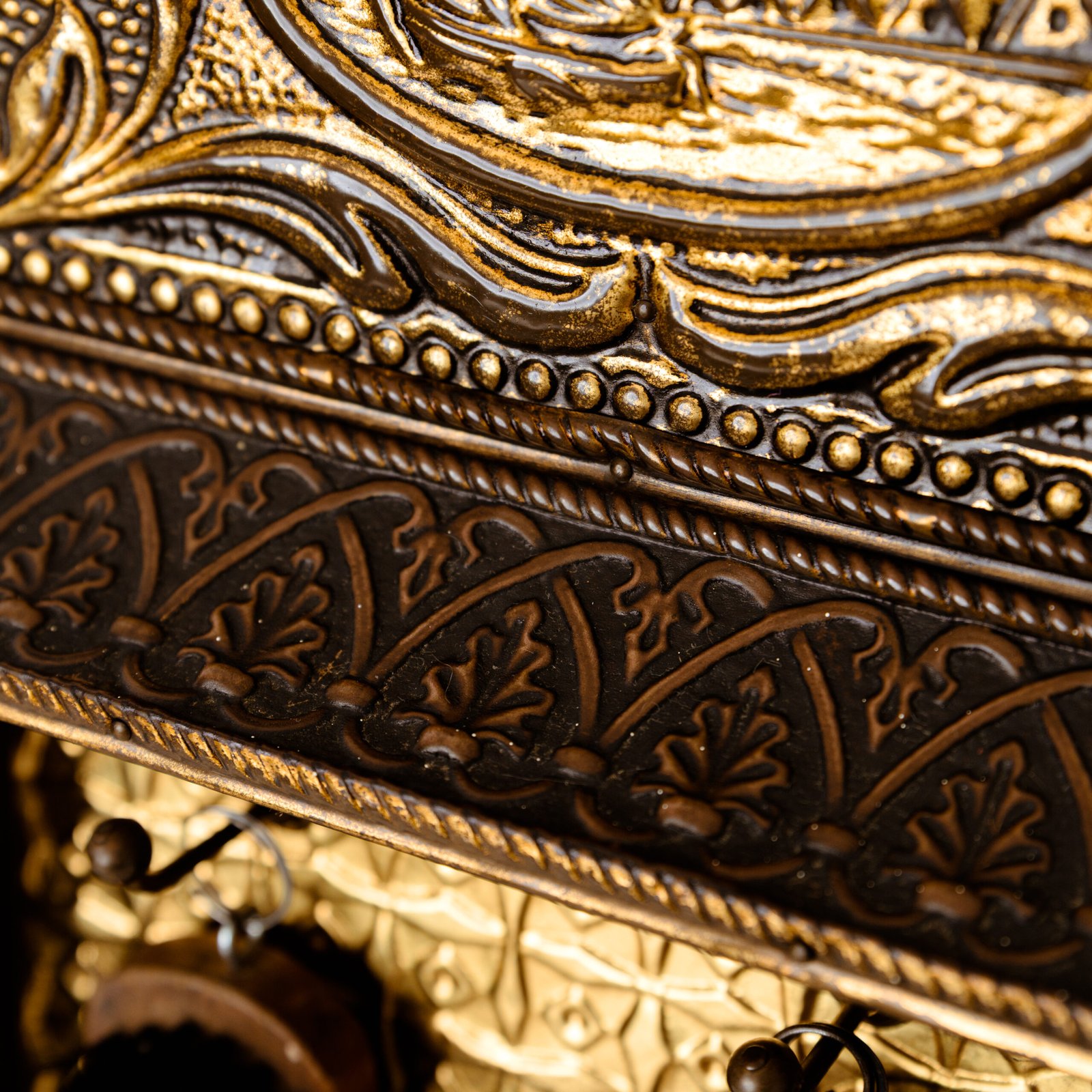 Dutch Mirror Cabinet in embossed brass with windmill motif, beveled mirror door and interior brushes, circa 1890–1920.