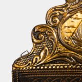 Dutch Mirror Cabinet in embossed brass with windmill motif, beveled mirror door and interior brushes, circa 1890–1920.