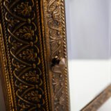 Dutch Mirror Cabinet in embossed brass with windmill motif, beveled mirror door and interior brushes, circa 1890–1920.