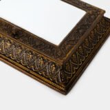 Dutch Mirror Cabinet in embossed brass with windmill motif, beveled mirror door and interior brushes, circa 1890–1920.