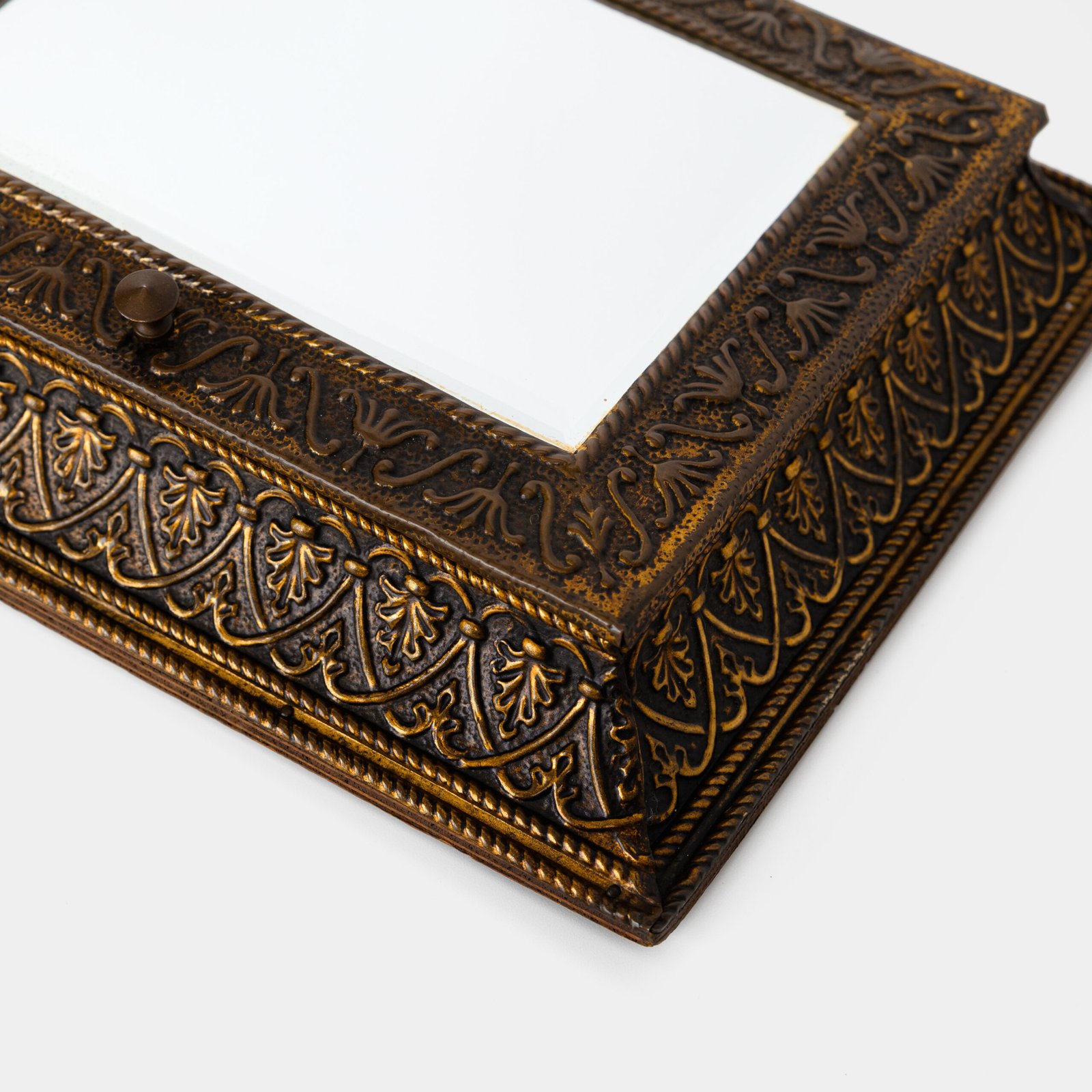 Dutch Mirror Cabinet in embossed brass with windmill motif, beveled mirror door and interior brushes, circa 1890–1920.