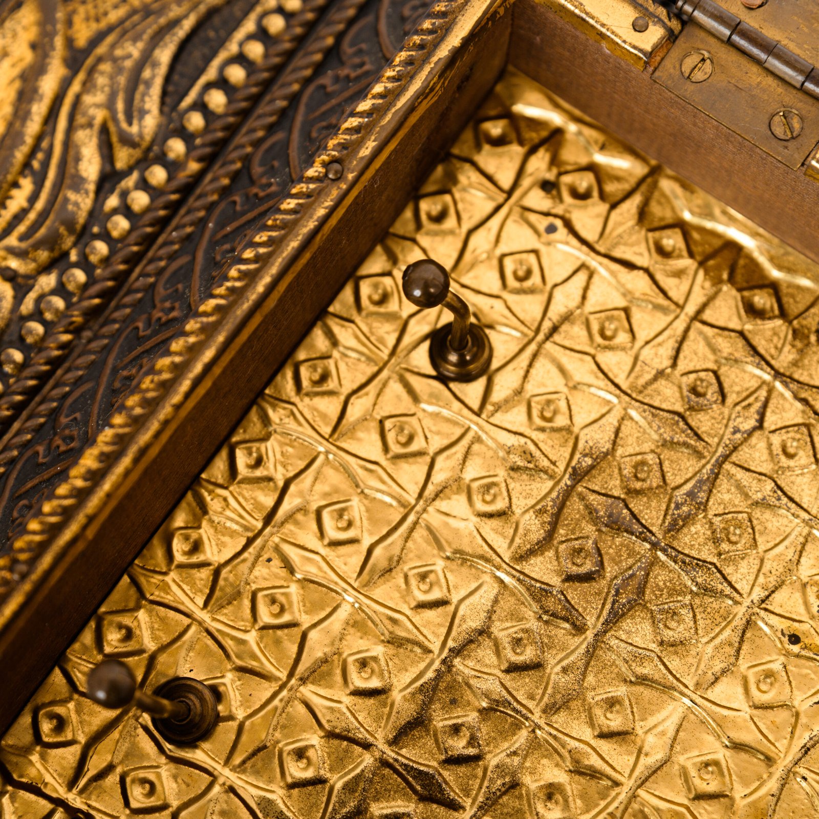 Dutch Mirror Cabinet in embossed brass with windmill motif, beveled mirror door and interior brushes, circa 1890–1920.