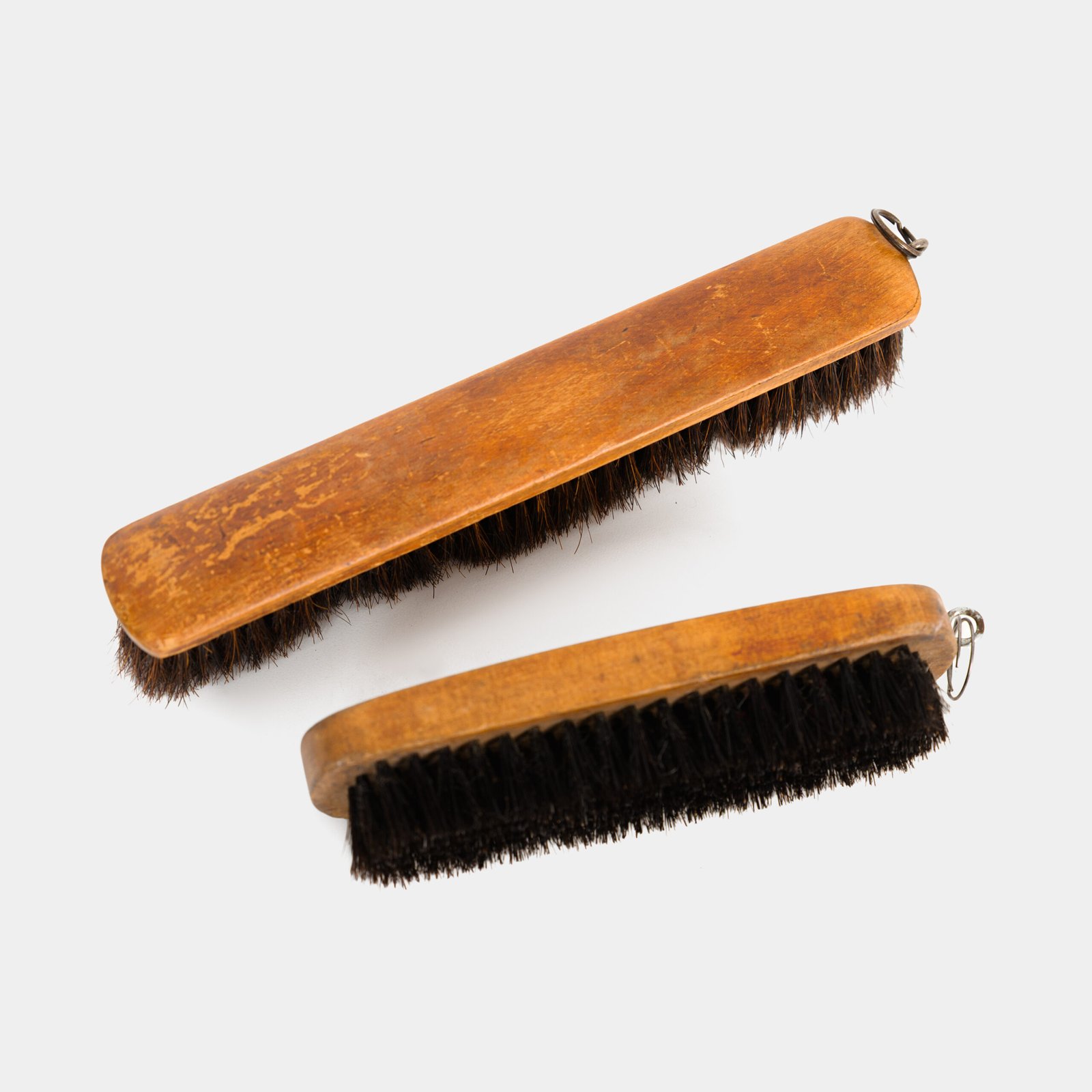 Dutch Mirror Cabinet in embossed brass with windmill motif, beveled mirror door and interior brushes, circa 1890–1920.