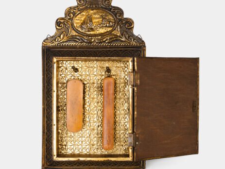 Dutch Mirror Cabinet in embossed brass with windmill motif, beveled mirror door and interior brushes, circa 1890–1920.