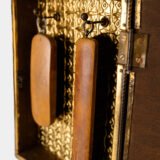 Dutch Mirror Cabinet in embossed brass with windmill motif, beveled mirror door and interior brushes, circa 1890–1920.