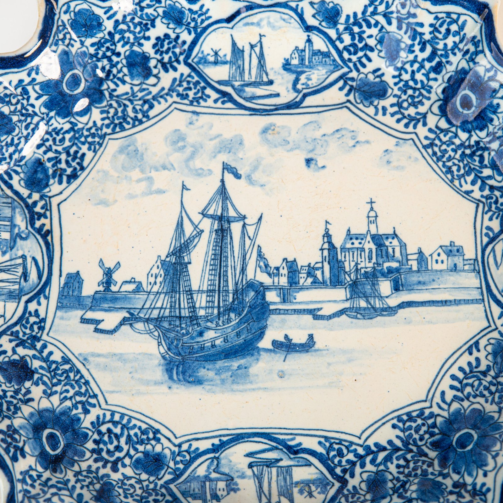 Early Delft lobed dish with harbour scene, hand-painted in cobalt blue, Netherlands c. 1695–1720