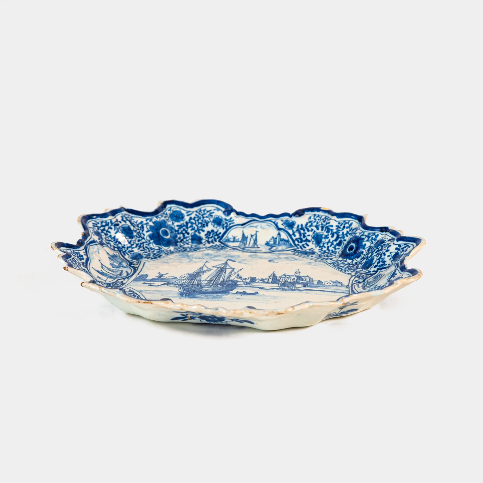 Early Delft lobed dish with harbour scene, hand-painted in cobalt blue, Netherlands c. 1695–1720