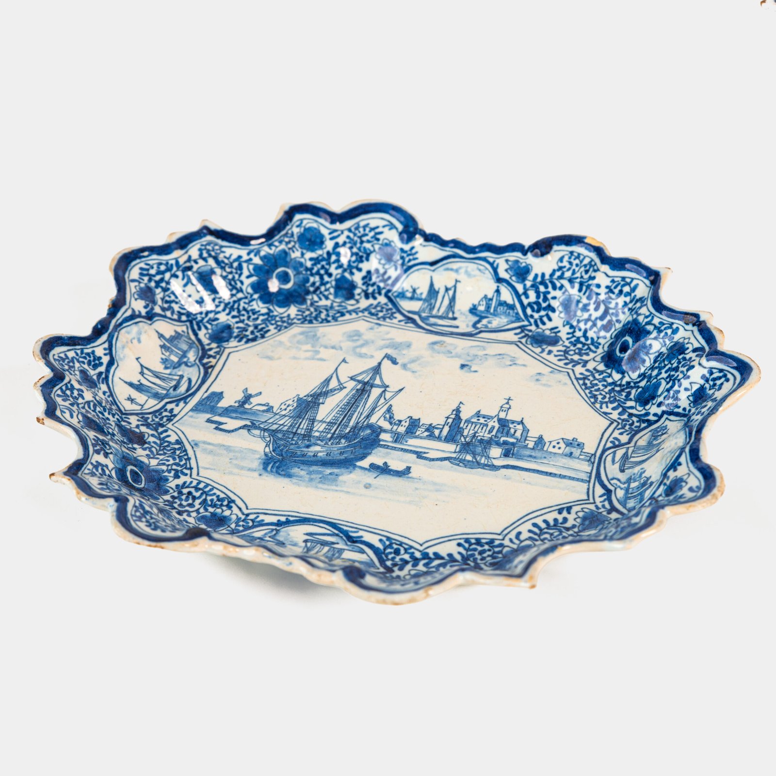 Early Delft lobed dish with harbour scene, hand-painted in cobalt blue, Netherlands c. 1695–1720