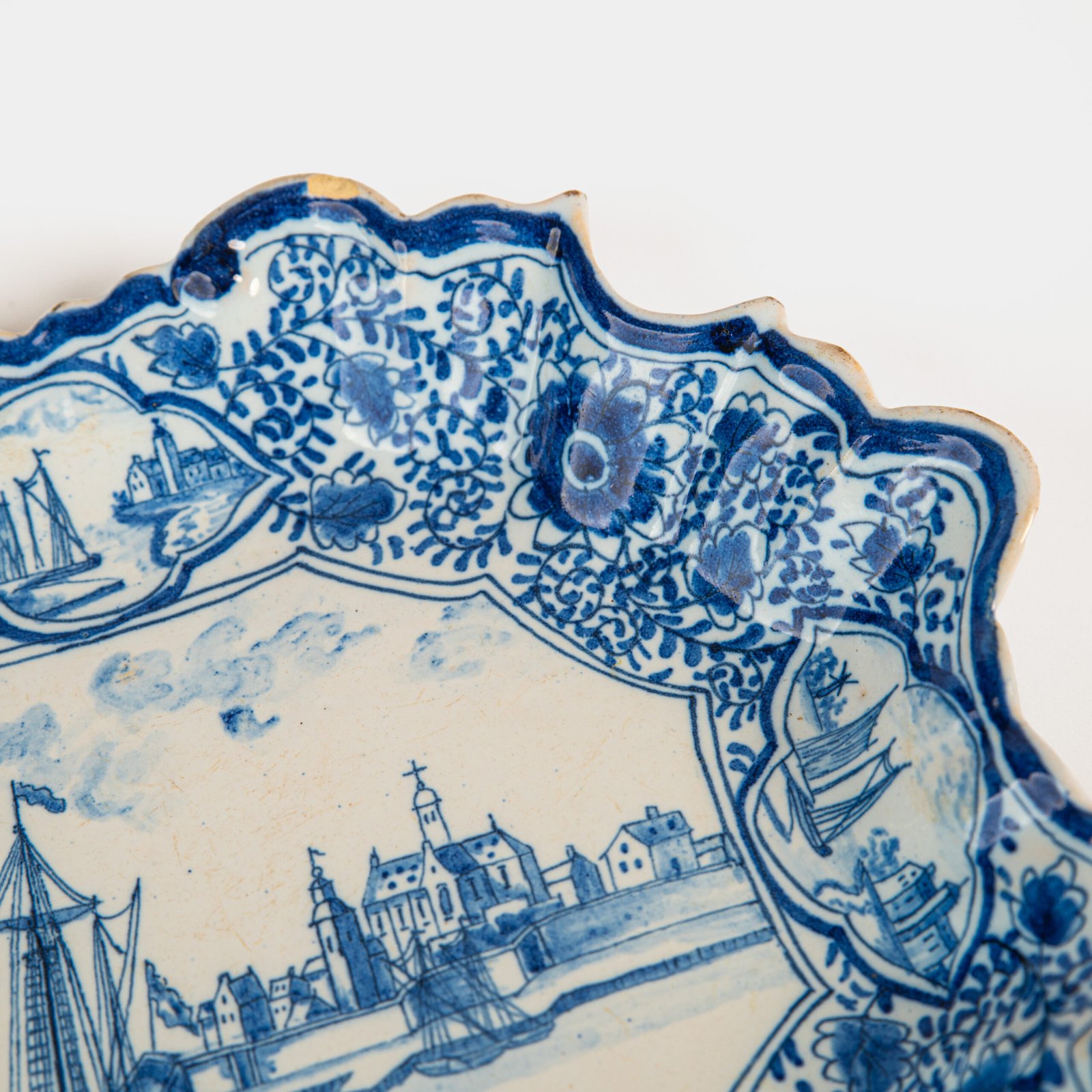 Early Delft lobed dish with harbour scene, hand-painted in cobalt blue, Netherlands c. 1695–1720