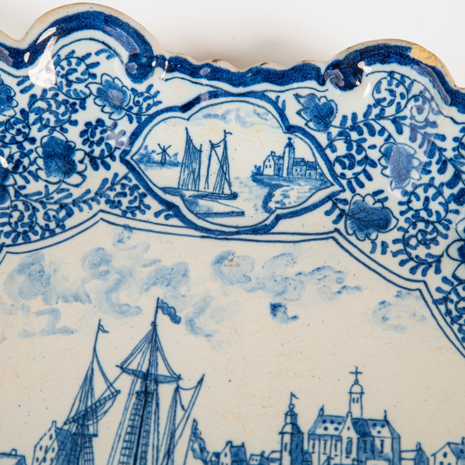 Early Delft lobed dish with harbour scene, hand-painted in cobalt blue, Netherlands c. 1695–1720