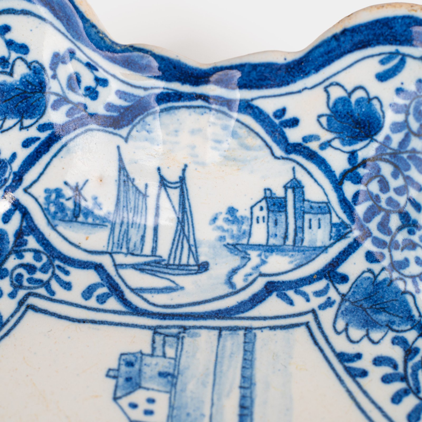 Early Delft lobed dish with harbour scene, hand-painted in cobalt blue, Netherlands c. 1695–1720