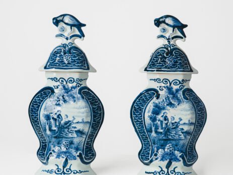 Antique Delft Vases in cobalt blue with lid and bird finial, hand-painted hexagonal bodies with Dutch scenes and blue underglaze mark on the base.