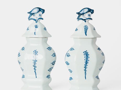 Antique Delft Vases in cobalt blue with lid and bird finial, hand-painted hexagonal bodies with Dutch scenes and blue underglaze mark on the base.
