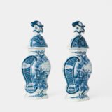 Antique Delft Vases in cobalt blue with lid and bird finial, hand-painted hexagonal bodies with Dutch scenes and blue underglaze mark on the base.