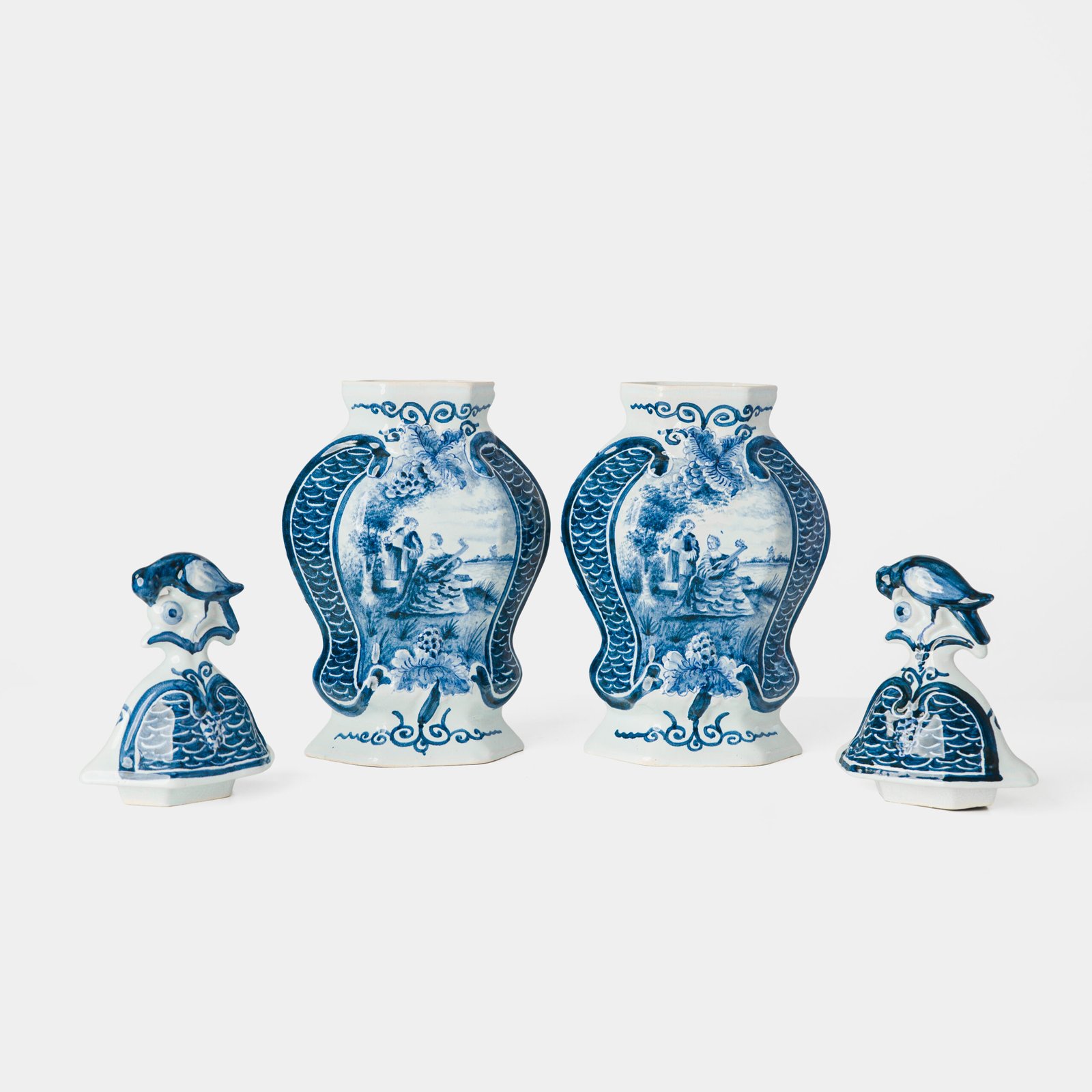 Antique Delft Vases in cobalt blue with lid and bird finial, hand-painted hexagonal bodies with Dutch scenes and blue underglaze mark on the base.