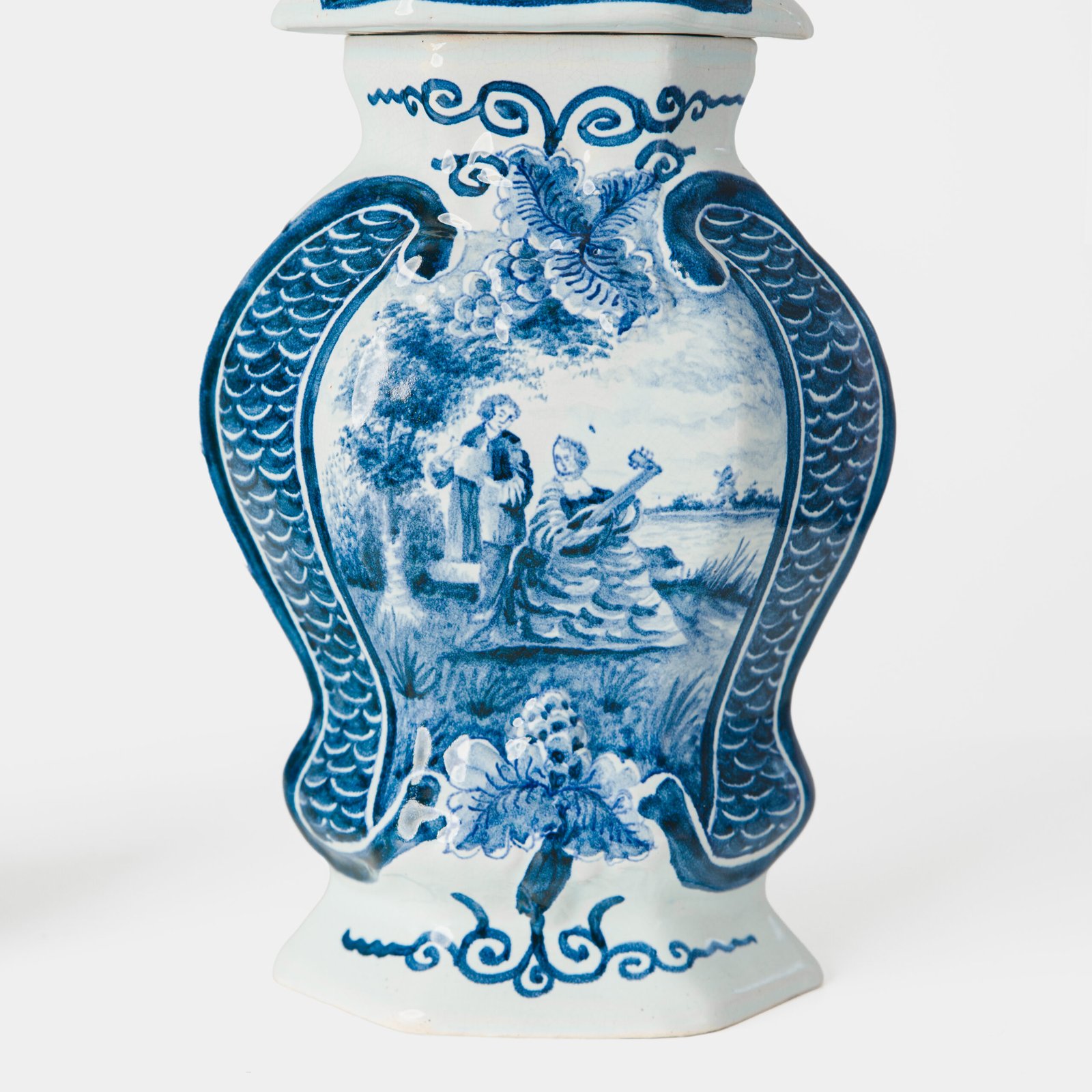 Antique Delft Vases in cobalt blue with lid and bird finial, hand-painted hexagonal bodies with Dutch scenes and blue underglaze mark on the base.