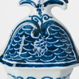 Antique Delft Vases in cobalt blue with lid and bird finial, hand-painted hexagonal bodies with Dutch scenes and blue underglaze mark on the base.