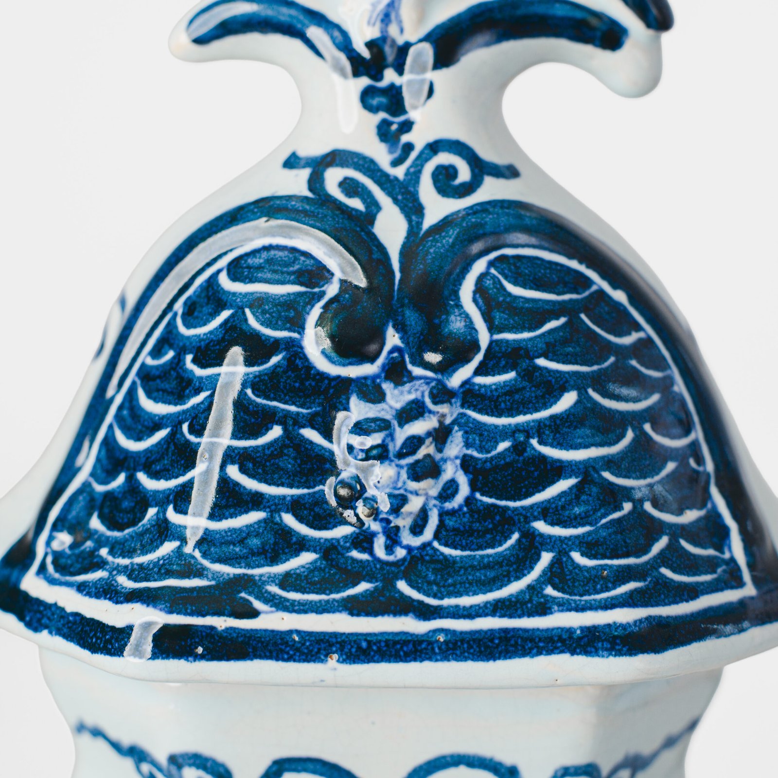 Antique Delft Vases in cobalt blue with lid and bird finial, hand-painted hexagonal bodies with Dutch scenes and blue underglaze mark on the base.