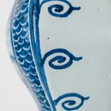 Antique Delft Vases in cobalt blue with lid and bird finial, hand-painted hexagonal bodies with Dutch scenes and blue underglaze mark on the base.