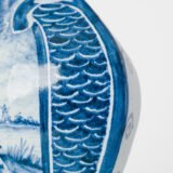 Antique Delft Vases in cobalt blue with lid and bird finial, hand-painted hexagonal bodies with Dutch scenes and blue underglaze mark on the base.
