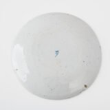 Antique Delft Plate from the early 18th century, crafted at the De Drie Porceleyne Flessies workshop, featuring the WK mark of Willem van der Kool and his widow Cornelia van Schoonhoven.