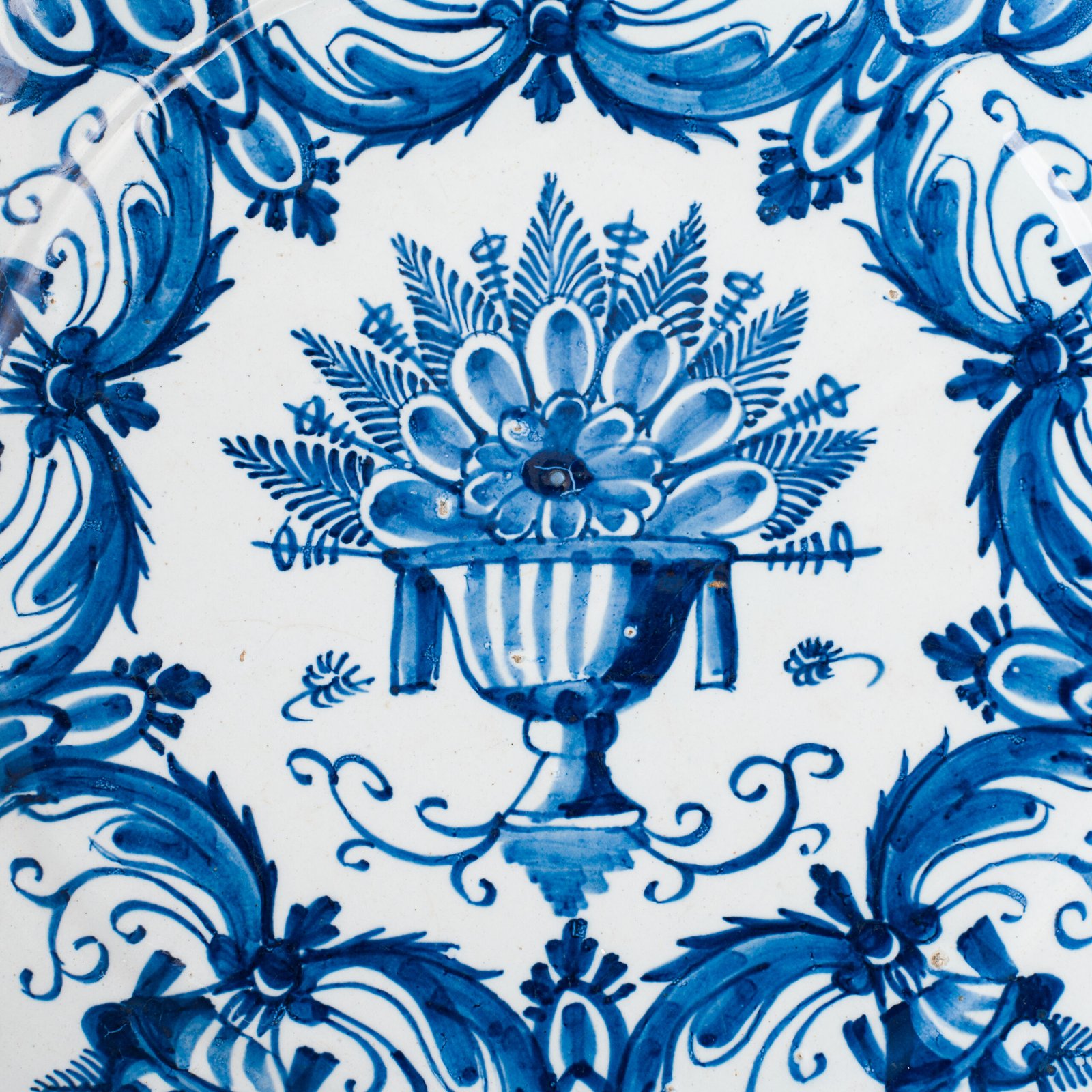 Antique Delft Plate from the early 18th century, crafted at the De Drie Porceleyne Flessies workshop, featuring the WK mark of Willem van der Kool and his widow Cornelia van Schoonhoven.