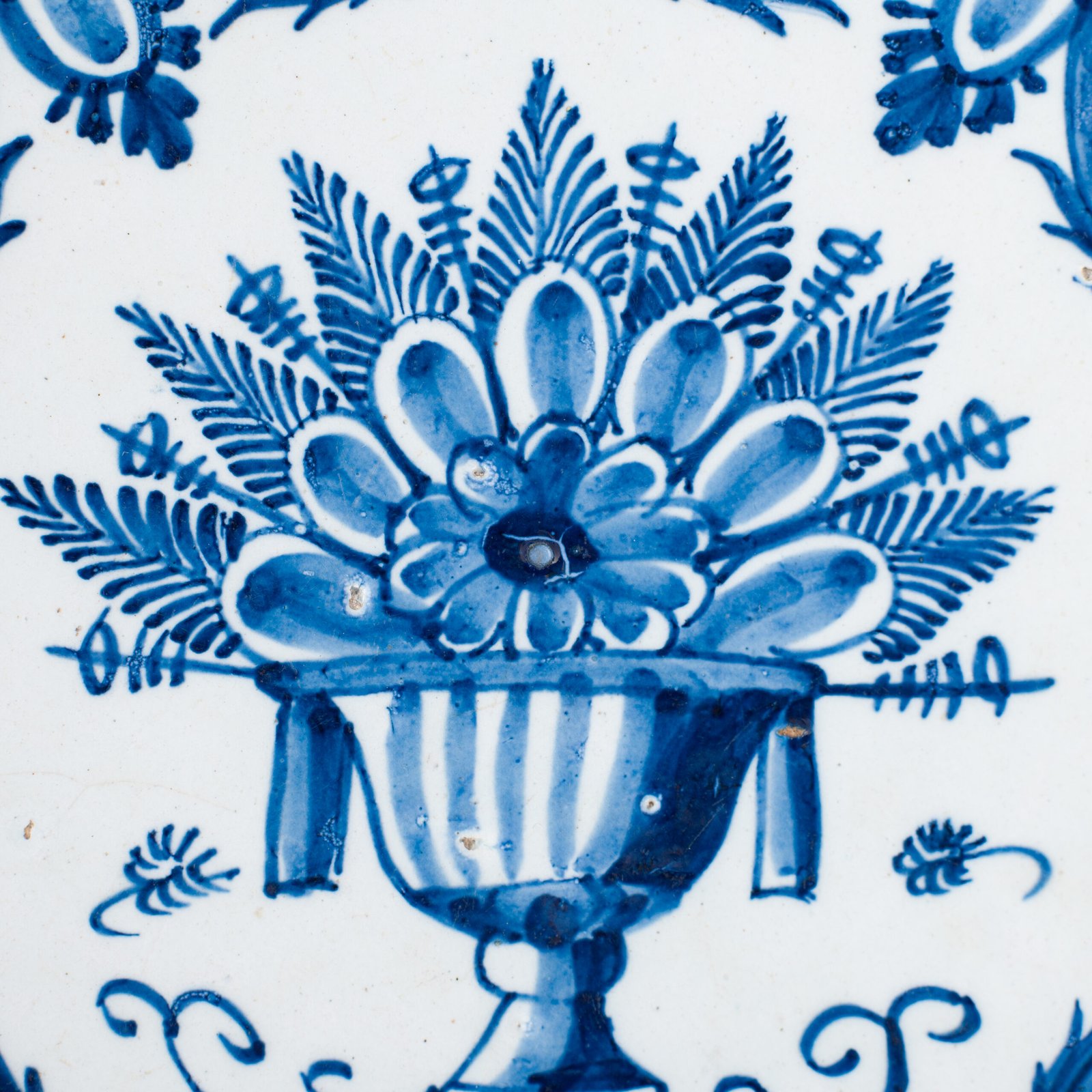 Antique Delft Plate from the early 18th century, crafted at the De Drie Porceleyne Flessies workshop, featuring the WK mark of Willem van der Kool and his widow Cornelia van Schoonhoven.