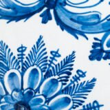 Antique Delft Plate from the early 18th century, crafted at the De Drie Porceleyne Flessies workshop, featuring the WK mark of Willem van der Kool and his widow Cornelia van Schoonhoven.