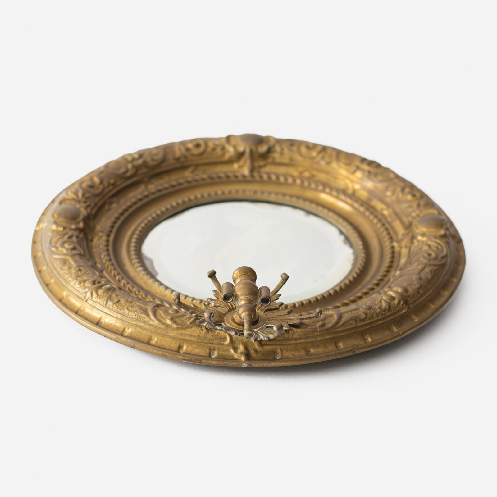 Antique Swedish Brass Mirror with repoussé Neoclassical frame and original beveled glass, 1890–1910.