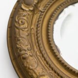Antique Swedish Brass Mirror with repoussé Neoclassical frame and original beveled glass, 1890–1910.