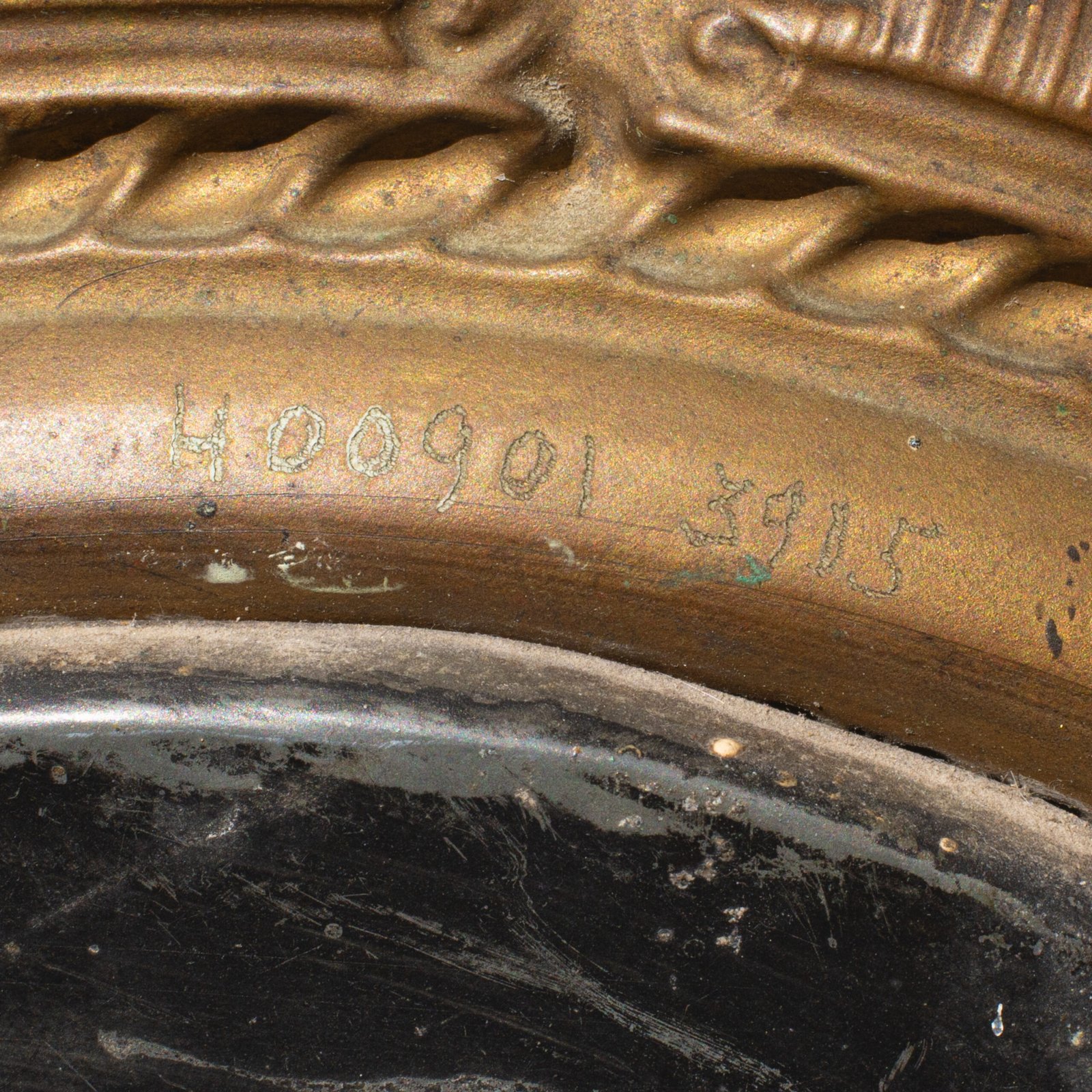 Antique Swedish Brass Mirror with repoussé Neoclassical frame and original beveled glass, 1890–1910.